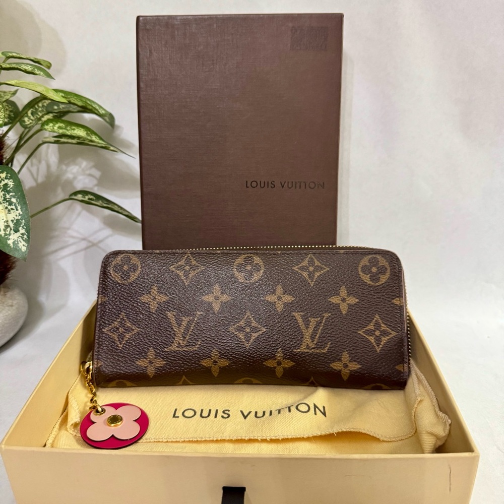 LOUIS VUITTON Monogram Canvas 
Clemence Flower Charm Zippy Wallet